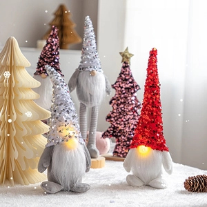 Festive LED Christmas gnome dolls with sequins and golden stars for tabletop decoration