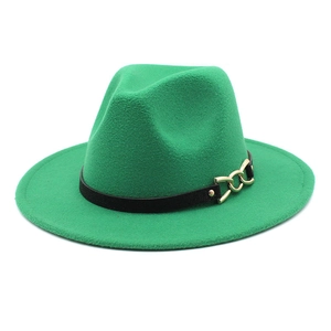 Detail of emerald green wool fedora hat with black leather band and gold chain buckle