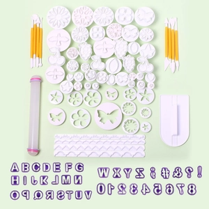 Flat lay of a complete fondant baking set with assorted cutters and carving tools