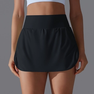 Detail of high waisted black tennis skirt with inner shorts and smooth elastic fabric