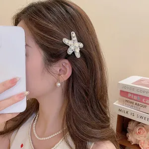 Sparkling starfish hair clip with crystals for women worn on side hair style