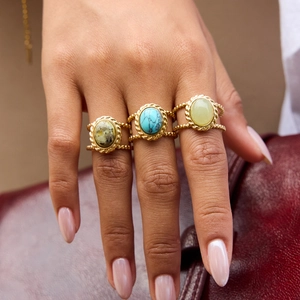 Three-piece set of 18K gold plated stainless steel rings featuring turquoise gemstones