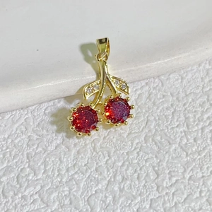 Exquisite 18K gold plated cherry pendant with vibrant red crystals and micro-set leaf zircons