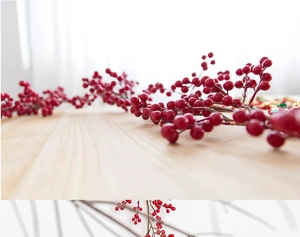 Close-up of decorative red berries with realistic foam coating and vivid color detail