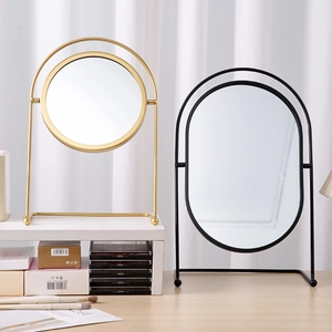 Rotating desktop iron vanity mirrors in round gold and oval black frames for makeup