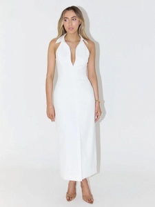 Detail view of sleeveless white shirt dress featuring a lapel collar and button-up front