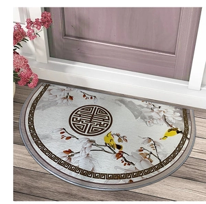 Detail of semi-circle door mat with traditional floral pattern and bird embroidery