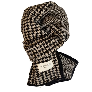 Winter houndstooth knitted scarf in black and white with a minimalist Nice To Meet label