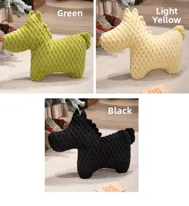Detail of plush pony cushions in green, yellow and black with soft dotted textured fabric