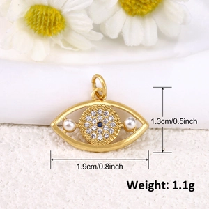 Detail view of gold eye pendant with pearl and zircon showing dimensions and weight