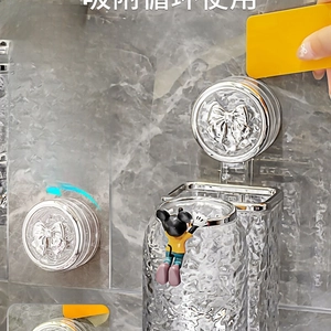 Wall-mounted toothbrush holder with vacuum suction cup and Mickey Mouse character detail