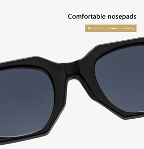 Detail of integrated comfortable nose pads on black irregular frame sunglasses