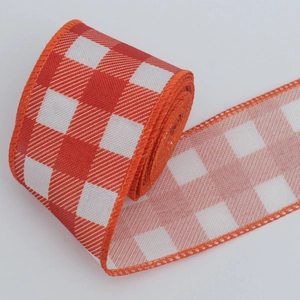 Detail of orange and white checkered faux linen ribbon with wired edges for gift wrapping