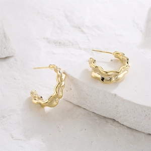 Irregular 14K gold-plated hoop earrings with wavy hammered texture on stone base