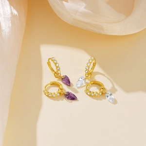 Close-up of S925 sterling silver gold-plated hoop earrings with teardrop zircon pendants