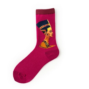 Detailed close-up of Queen Nefertiti portrait knitting on magenta crew socks