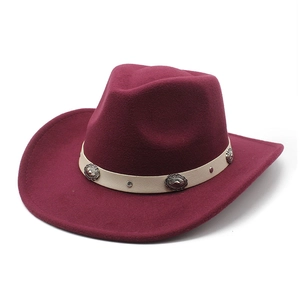 Detail of burgundy wool cowboy hat featuring cream leather band and retro silver buckles