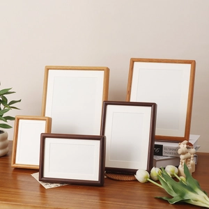 Minimalist walnut wood photo frame set with white mat for wall hanging or tabletop decor