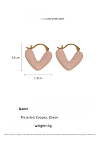 Detail view of 1.8cm gold-plated heart earrings with pink enamel and cubic zirconia