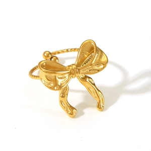 Detailed view of an adjustable golden butterfly ring with a polished metallic finish