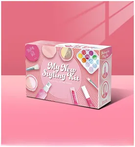 Close-up of pink pretend play makeup kit packaging with simulated brushes and eye shadows