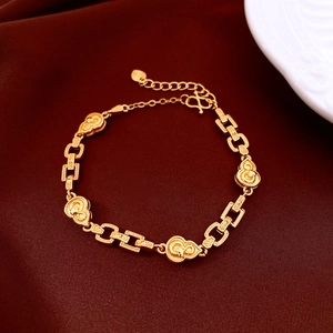 Detail of 24K gold-plated beaded flower bracelet with cloud and gourd charms