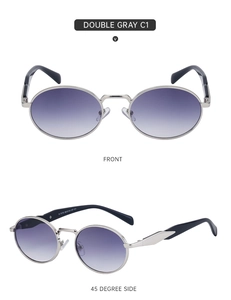 Close-up of retro oval sunglasses with silver metal frame and gradient gray lenses