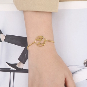 Detail of adjustable gold-plated stainless steel box chain bracelet with world map pendant