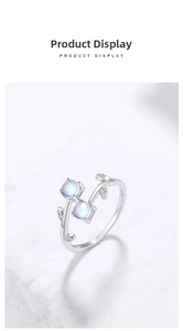 Detail of S925 silver vine ring featuring delicate green leaves and blue moonstones