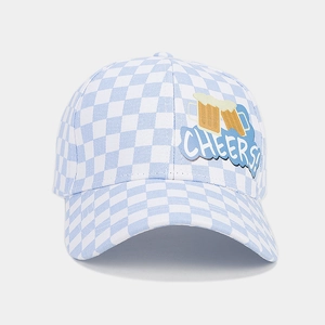 Close-up of blue plaid baseball cap with embroidered beer mugs and Cheers lettering