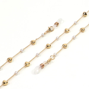 Detail of gold heart beads and white pearls on a multifunctional eyewear chain strap
