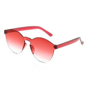 Detail view of red gradient lenses with unique wavy rimless edges and translucent temples