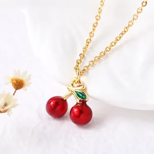 Gold-plated cherry pendant necklace for women with vibrant red fruit and green leaves