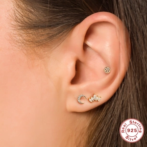 Three-piece gold 925 sterling silver ear piercing set with moon and crown designs