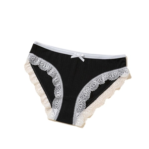 Women's black ribbed polyester panties with white lace trim in a flat lay view