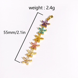 Elegant gold flower tassel pendant with colorful zircon stones in rainbow gradient style