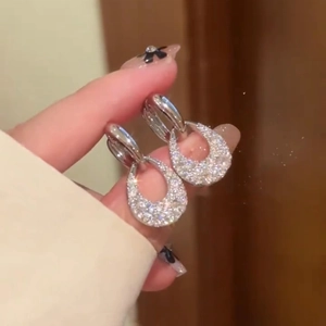 French-style hollow teardrop earrings in silver finish with sparkling zircon stones