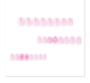 Detail of 24pcs pink gradient press-on nails with white floral and polka dot 3D patterns