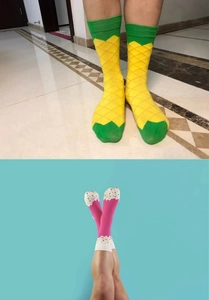 Detail showing yellow pineapple pattern and pink dotted crew socks for men and women