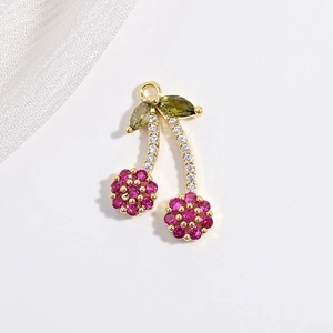 Copper cherry pendant with pink and green colorful crystals on white background