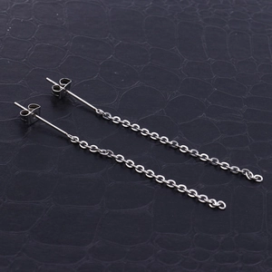 Minimalist silver stainless steel long chain drop earrings on black leather background