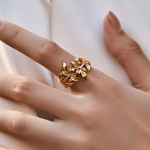 Golden feather open ring with sparkling crystal pave setting for a layered vintage look