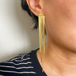 Elegant 18k gold plated stainless steel long tassel drop earrings on female model