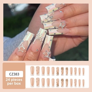 Detail of long square French nails with pink aurora finish, silver stars and rhinestones