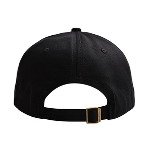 Rear view of minimalist black cotton baseball cap with adjustable bronze metal buckle