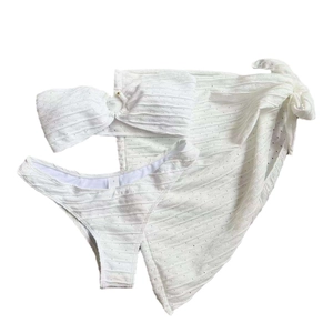Three-piece white bikini set including bandeau top, bottoms and matching sarong skirt