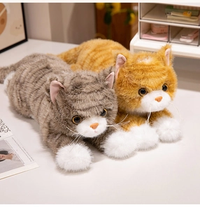 Detailed close-up of realistic grey and ginger tabby cat plush toys with soft faux fur