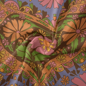 Detailed view of the soft fabric texture and bohemian floral pattern on this wall tapestry