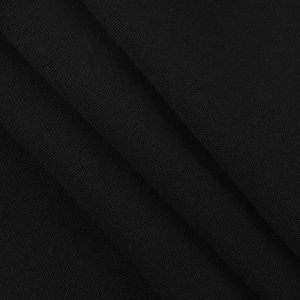 Macro shot of black knitted fabric texture showing premium mesh weave on women's suit
