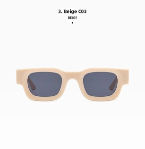 Detail view of beige retro rectangular sunglasses with dark grey lenses and thick frame